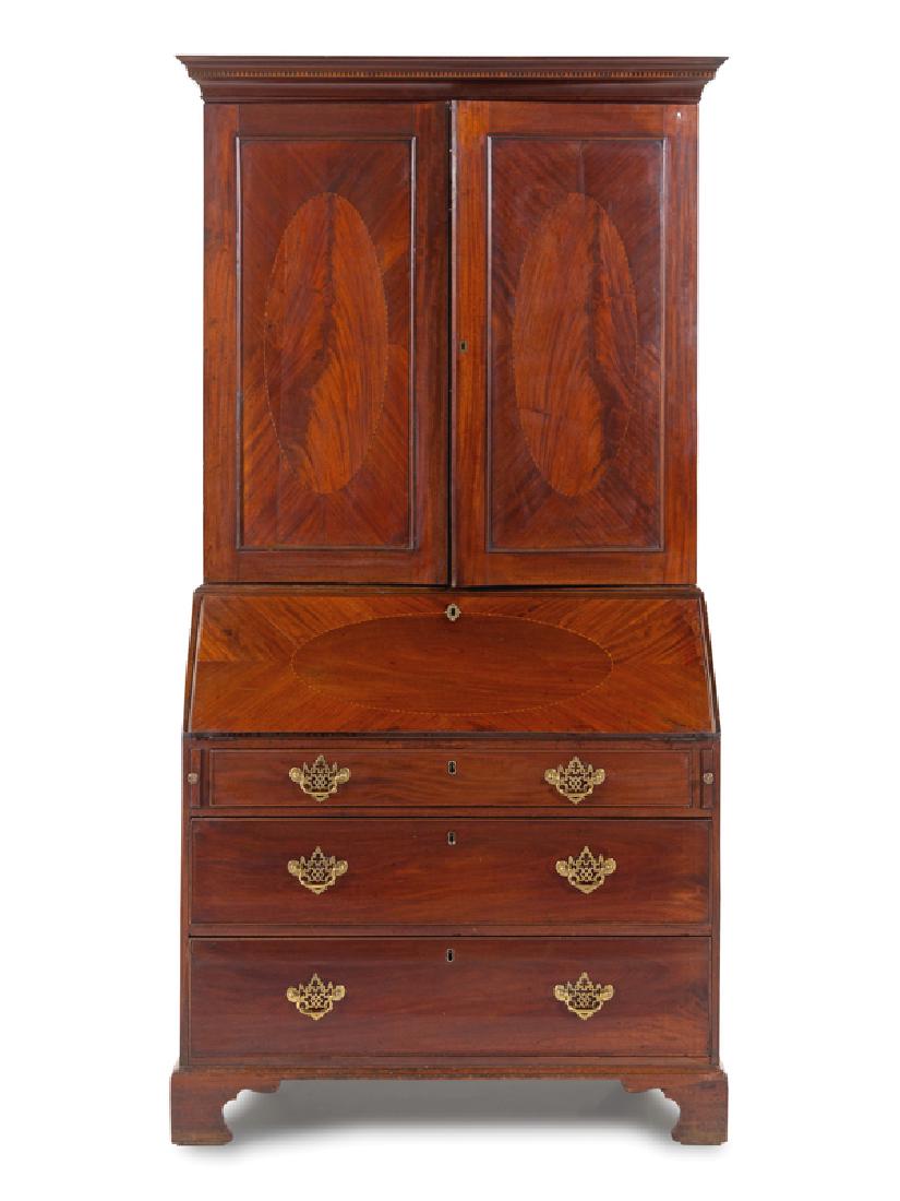 A George III Mahogany Slant-Front Secretary: A George III Mahogany Slant-Front Secretary Late 18th/Early 19th Century Height 86 x width 44 x depth 23 1/2 inches.