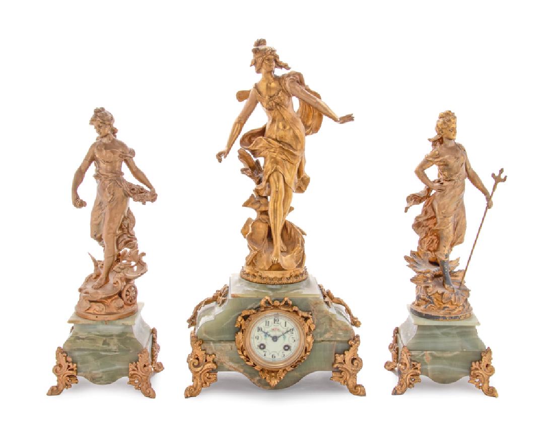 A French Onyx and Gilt Metal Clock Garniture (1 of 4)