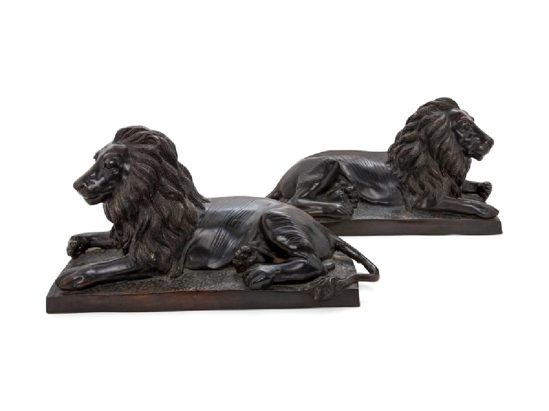 *A Pair of Bronze Models of Recumbent Lions: *A Pair of Bronze Models of Recumbent Lions Height 10 x width 20 1/4 inches. Property from the Collection of James Flynn and Bill Wiley, Chicago, Illinois