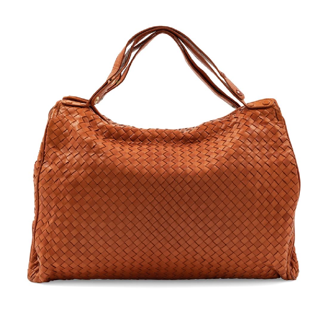 Charles Jourdan Bag, 1970-80s: Charles Jourdan Bag, 1970-80s Large brown leather intrecciato bag with expandable section secured with snaps. Thin straps form the handle, which is also expandable with snaps. Bag is lined with brown