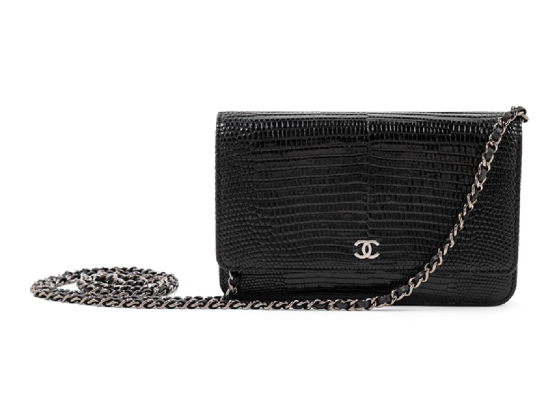 Chanel Lizard Wallet on a Chain, 2015-16: Chanel Lizard Wallet on a Chain, 2015-16 Black with gunmetal hardware, front slip pocket and zip pocket, interior compartment with slip pocket and card pockets, front flap with CC logo and a snap butt