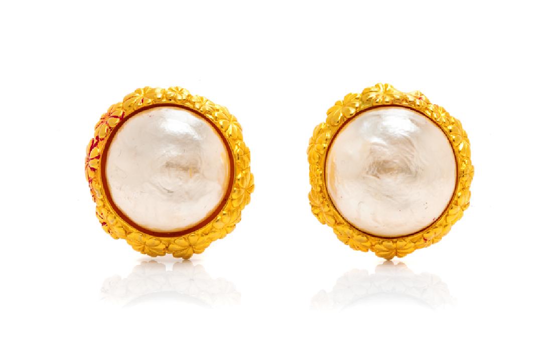 Karl Lagerfeld Earrings, 1980s: Karl Lagerfeld Earrings, 1980s Gold tone floral wreath with central faux pearl. 1.5" diameter. Condition: Overall good condition. Wear consistent with age. The stated overall condition of the lot 