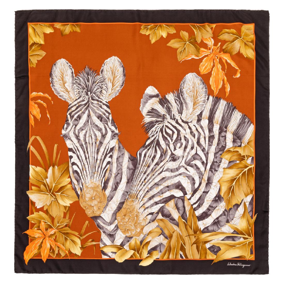 Salvatore Ferragamo Silk Scarf, 1980-90s: Salvatore Ferragamo Silk Scarf, 1980-90s Orange with zebra motif and black trim. Labeled within the print: Salvatore Ferragamo Approximate Size: 36" x 36" Condition: Overall good condition. Wear consi