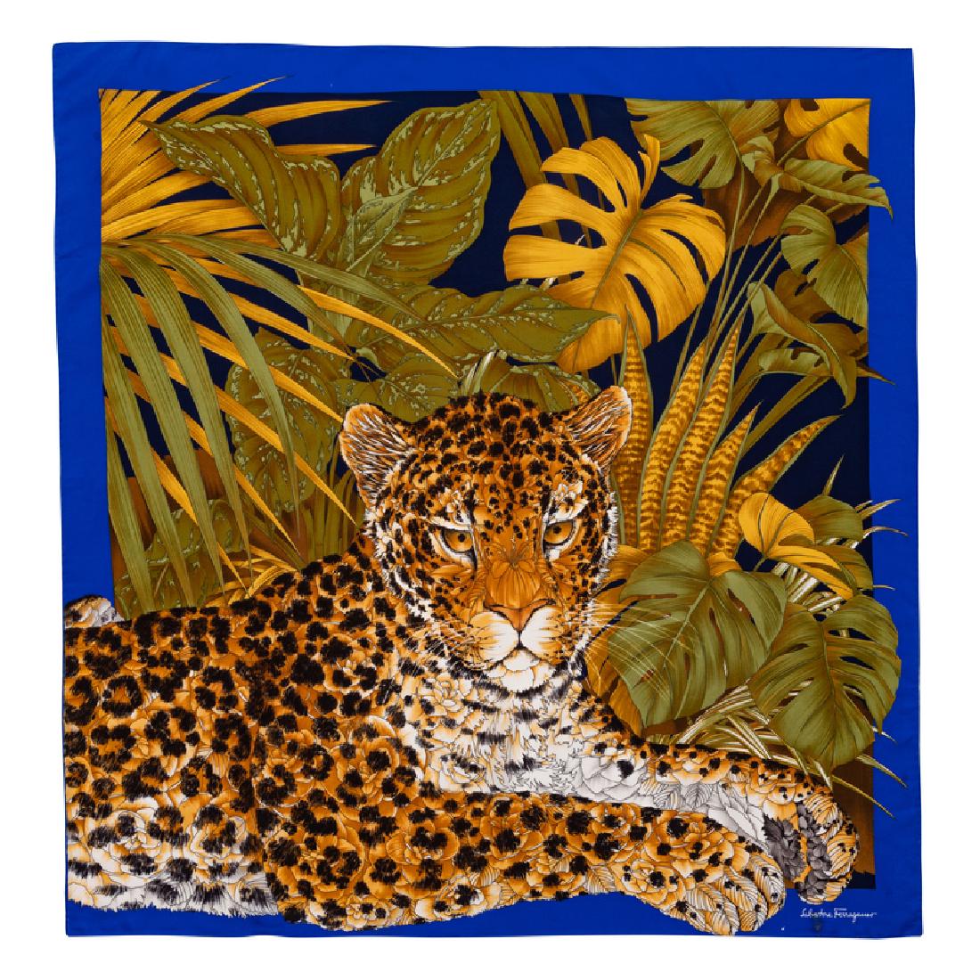 Salvatore Ferragamo Silk Scarf, 1980-90s: Salvatore Ferragamo Silk Scarf, 1980-90s Blue trim with leopard and green leaf motif. Labeled within the print: Salvatore Ferragamo Approximate Size: 36" x 36"