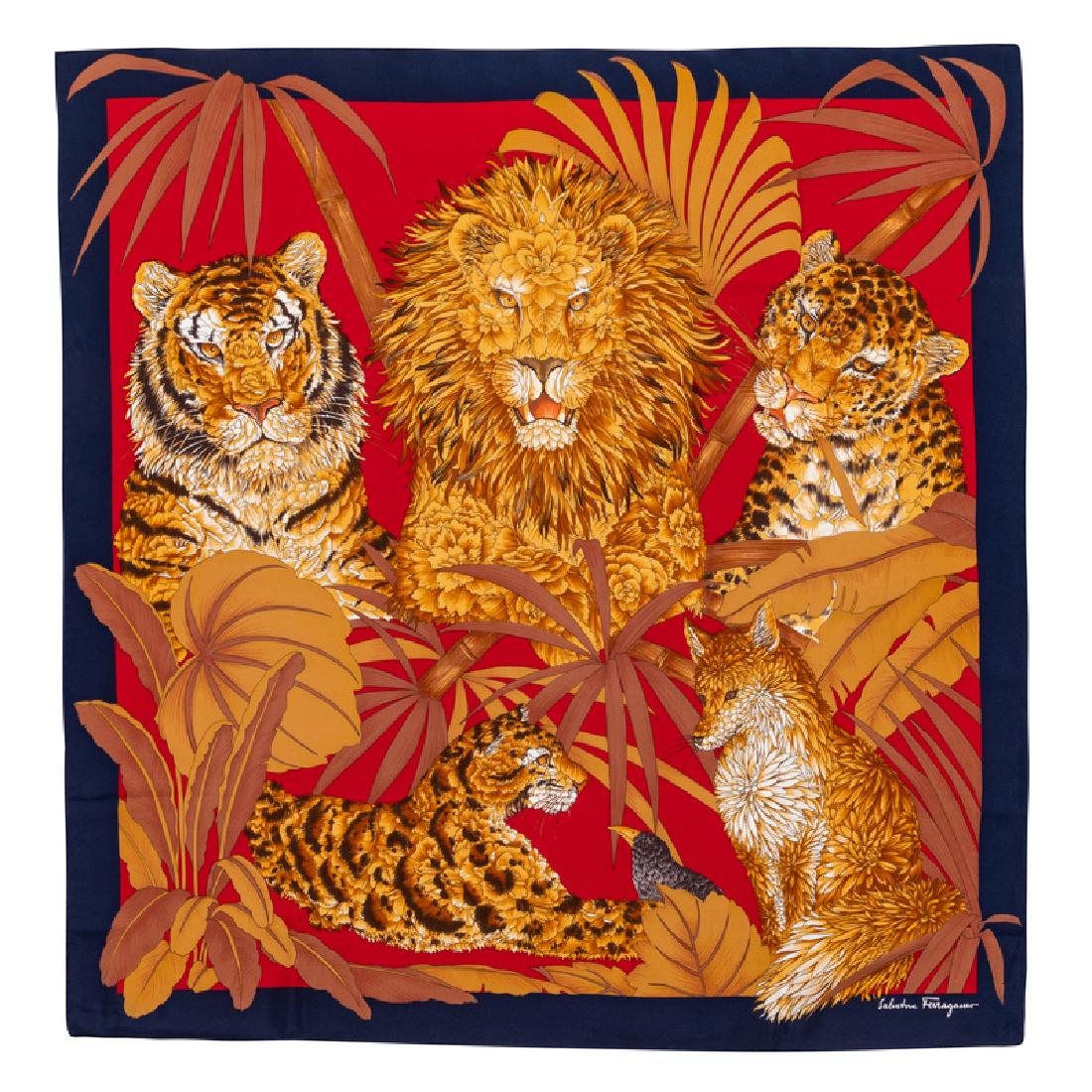 Salvatore Ferragamo Silk Scarf, 1990-2000s: Salvatore Ferragamo Silk Scarf, 1990-2000s Red sheer with lion motif with navy trim. Labeled within the print: Salvatore Ferragamo Approximate Size: 36" x 36" Condition: Overall good condition. T