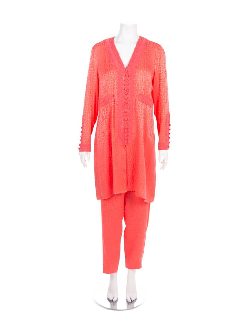Two Oscar de la Renta Size 12 Ensembles, 1980-90s: Two Oscar de la Renta Size 12 Ensembles, 1980-90s The first: Peach jacquard in a square pattern with a top and pants. The top is cut long with a v-neckline and trimmed with pink cord. The center front