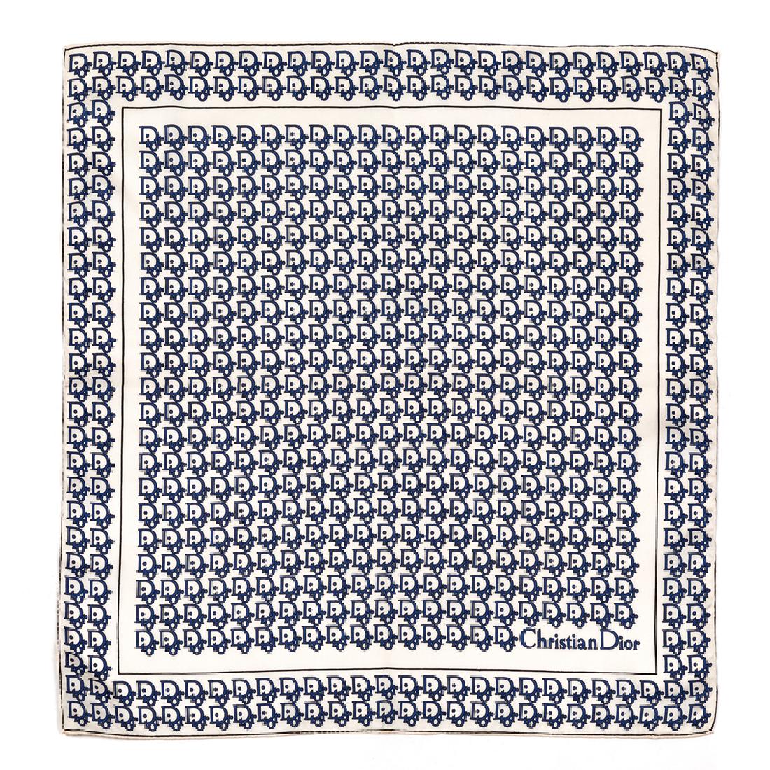 Christian Dior Handkerchief, 1970-80s: Christian Dior Handkerchief, 1970-80s White silk twill scarf printed with the words 'DIOR' in blue and black and in an all-over pattern. Label: Christian Dior / Made in Italy / Hand Rolled in Portugal