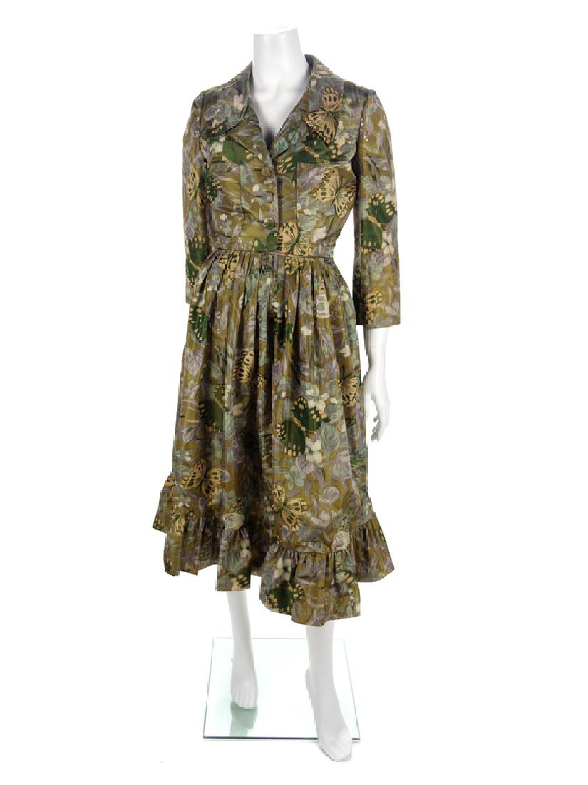 Galanos Jacket, Vest and Skirt, 1960s: Galanos Jacket, Vest and Skirt, 1960s All three items are made of the same Ikat print fabric in a floral scene with butterflies. The skirt is a-line with a gathered hem, wide waistband and center back