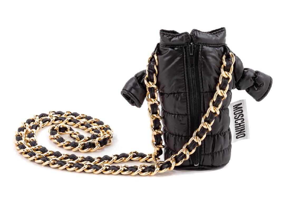 Moschino Mini Down Coat Bag, 2000s: Moschino Mini Down Coat Bag, 2000s Black down coat with stand collar, long sleeves and a center front zip. Attached to goldtone chain strap and with an exterior 'Moschino' tag and interior logo fabric