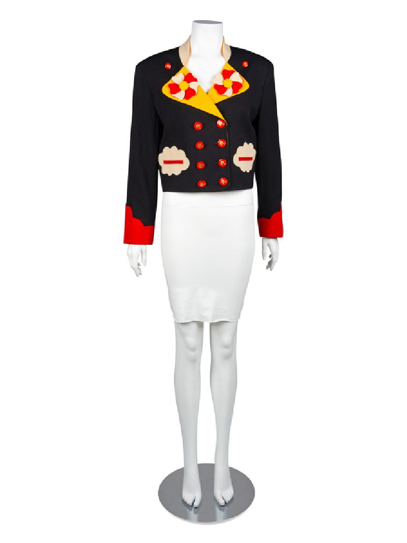 Moschino Jacket, 1990-2000s: Moschino Jacket, 1990-2000s Black double-breasted jacket with beige and yellow collar, beige cloud detailed welt pockets and red scalloped trimmed cuffs. Beige, red and yellow flower applique on col