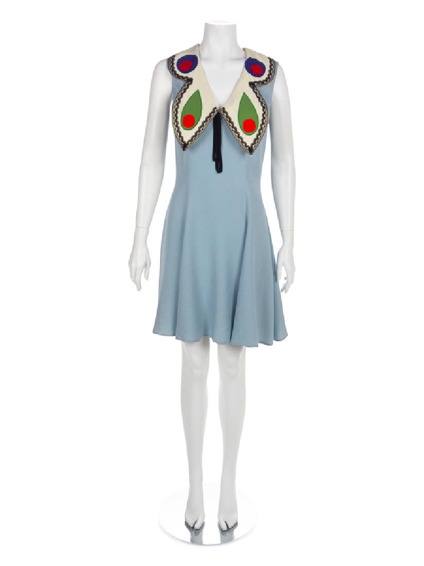 Moschino 'Butterfly' Dress, 1990s: Moschino 'Butterfly' Dress, 1990s Light blue satin-backed crepe a-line dress with butterfly-inspired collar trimmed with black lace. The dress is cut with a v-neckline, sleeveless and with a flared he