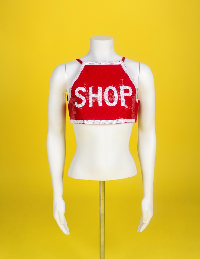 Moschino 'Shop' Top, 1990s: Moschino 'Shop' Top, 1990s Red sleeveless sequin cropped top with 'shop' in white sequin. Fully lined with thin red straps that button to the front panel and a covered zip closure at the left side sea