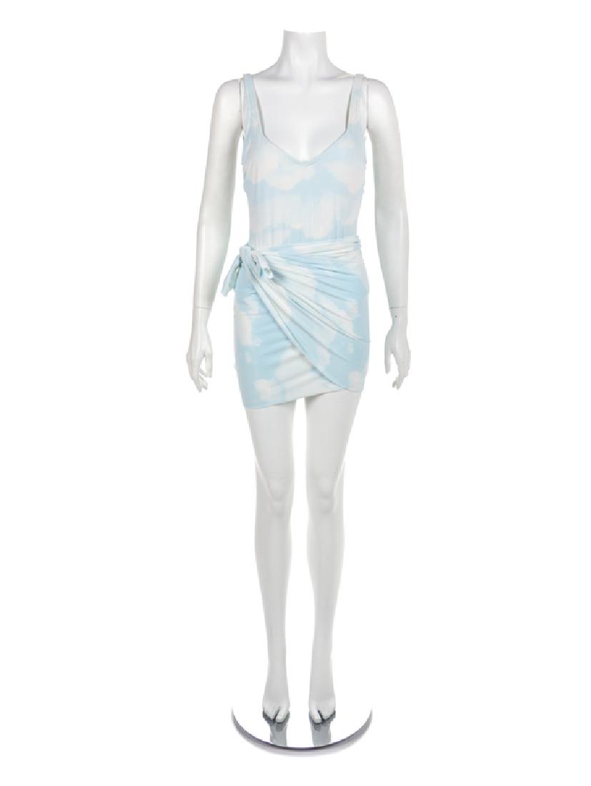 Moschino 'Cloud' Swimsuit and Wrap, 1990-2000s: Moschino 'Cloud' Swimsuit and Wrap, 1990-2000s Swimsuit printed with blue and white clouds with matching wrap. Label: Moschino / Mare / Made in Italy Size Label: 46 Condition: Overall very good c
