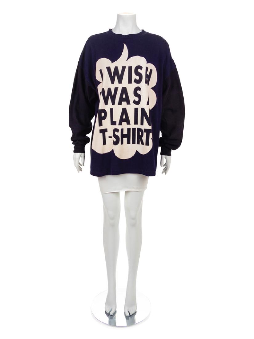 Moschino Sweatshirt, 1980-90s: Moschino Sweatshirt, 1980-90s Long sleeve blue cotton sweatshirt with black sleeves and a black back. The front is printed with a large white text bubble that reads 'I WISH I WAS A PLAIN T-SHIRT'. L