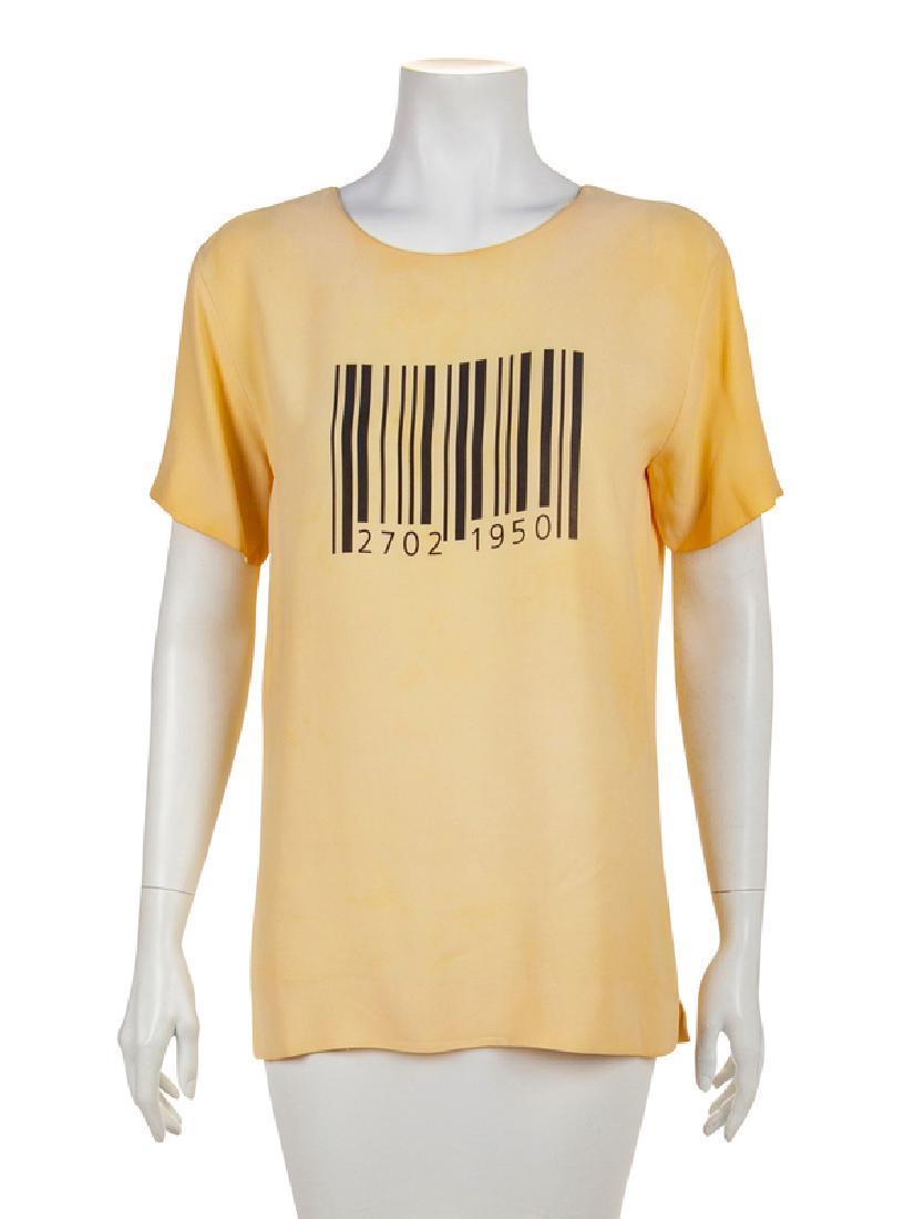Moschino Barcode Top, 1980-90s: Moschino Barcode Top, 1980-90s Cream short sleeved top with a crew neckline. A black bar code is printed at the center of the top, along with the numbers '2712' & '1950', which is the birthday of the