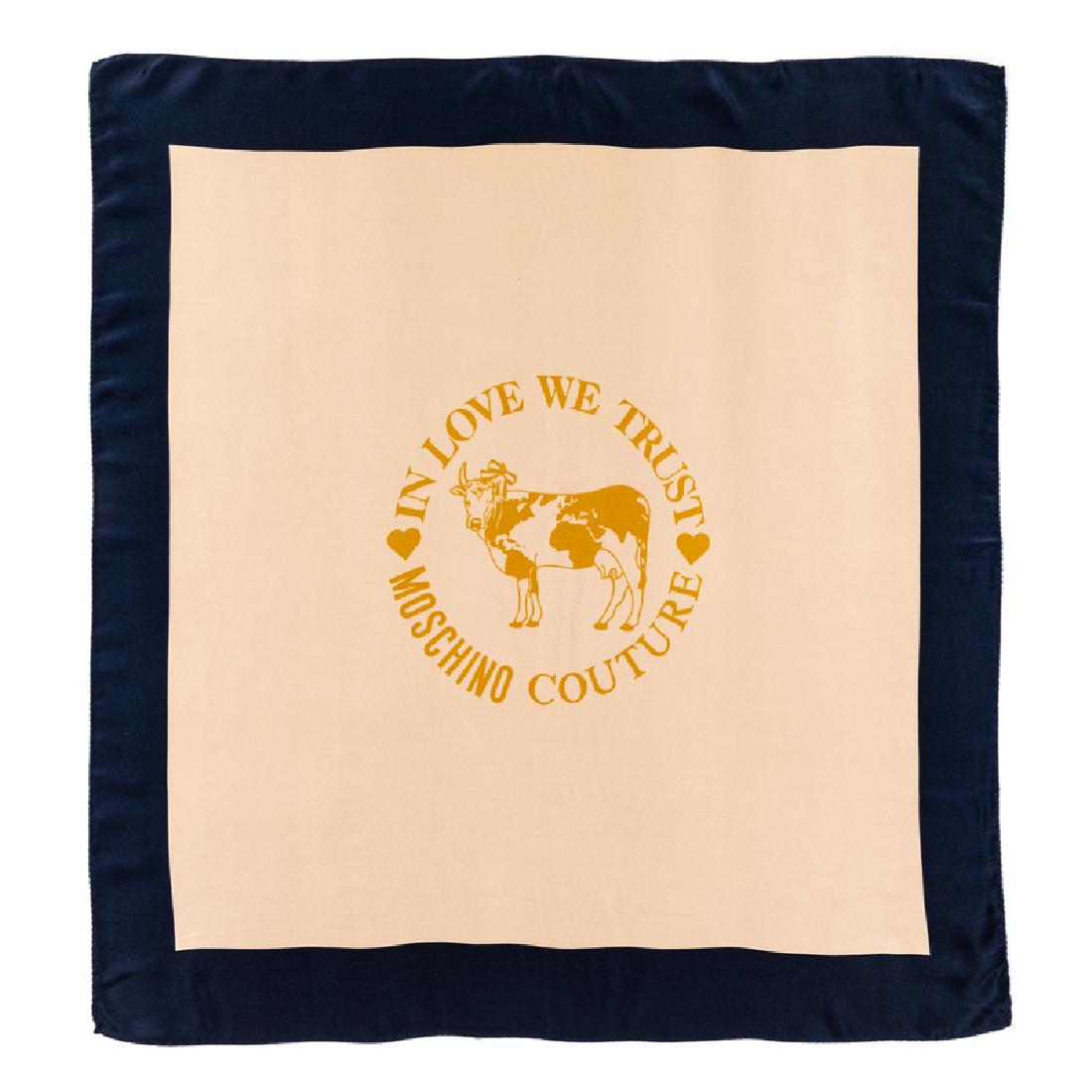 Moschino Shawl, 1990s: Moschino Shawl, 1990s Blue and cream silk satin scarf printed with a yellow cow in the center surrounded by the words 'IN LOVE WE TRUST' and 'MOSCHINO COUTURE'. Label: Moschino / Foulards Approximate