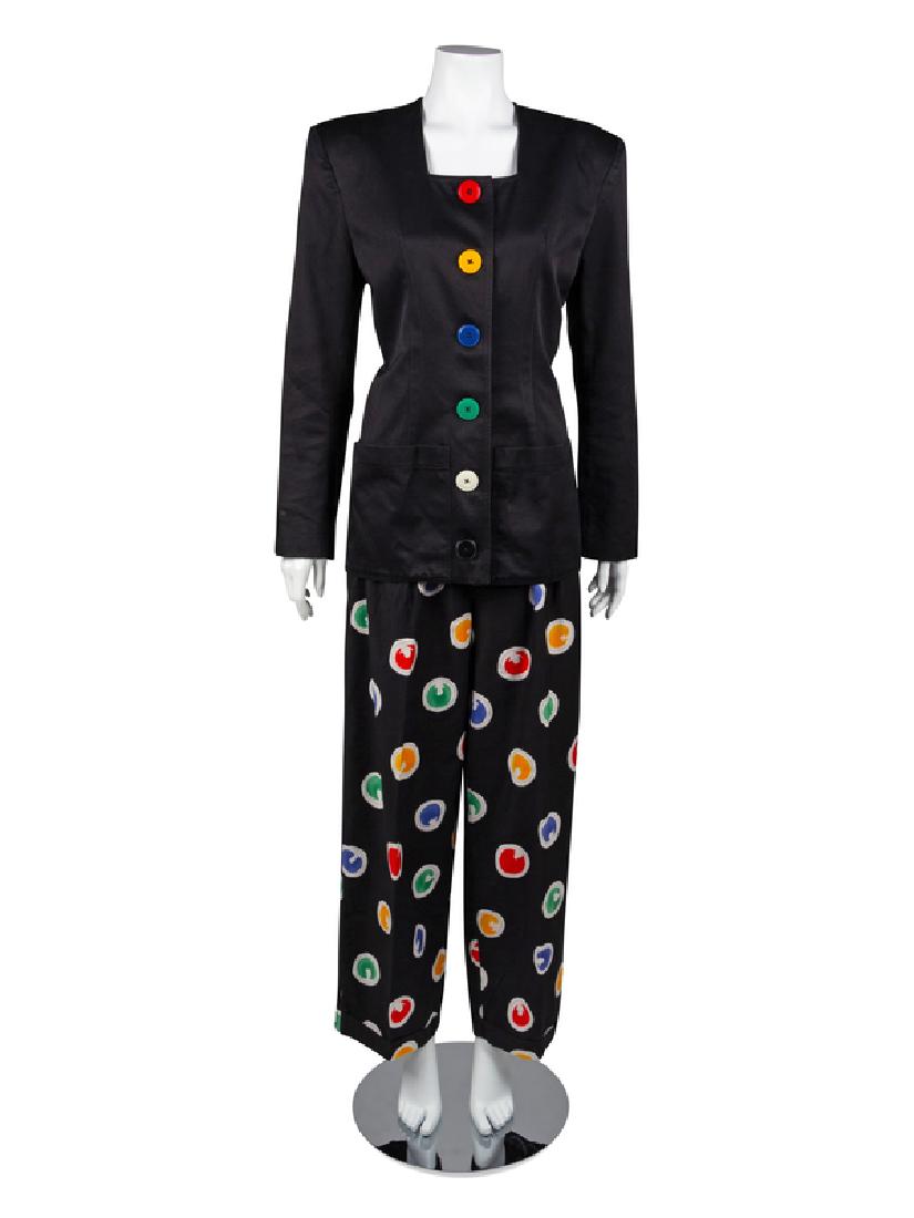 Patrick Kelly Suit, 1980-90s: Patrick Kelly Suit, 1980-90s A suit made of a jacket and pants. The black cotton twill jacket is cut with a squared neckline, shoulder pads, long sleeves and two patch pockets on the front hips. The j