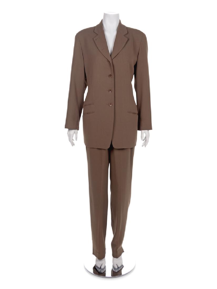 Ungaro Suit, 1980-90s: Ungaro Suit, 1980-90s Brown suit of jacket and pants. Jacket has a notched lapel, long sleeves, three front pockets and a center front button closure. Label: Ungaro Condition: Overall good condition.