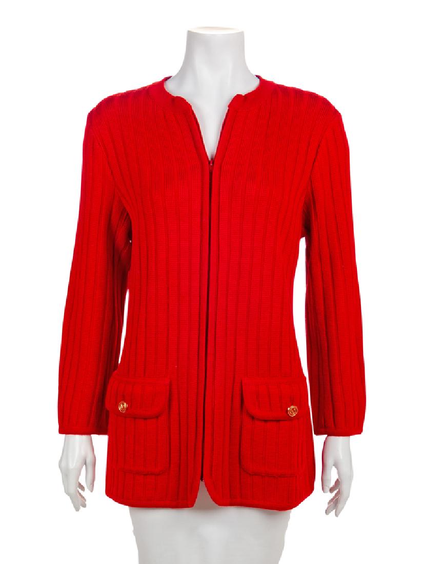 Valentino Cardigan, 1980-90s: Valentino Cardigan, 1980-90s Red wool knit cardigan with a crew neckline, long sleeves, patch pockets with flaps and a center front zip closure. The pockets are closed with a goldtone and red enamel b