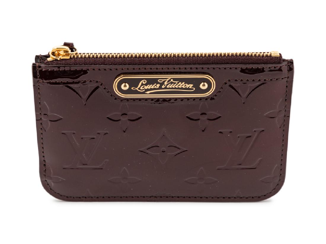 Louis Vuitton Card Holder, 1980-90s: Louis Vuitton Card Holder, 1980-90s Burgundy patent leather LV logo imprinted card holder. Length: 5" x Width: 3.5" Stamped: Louis Vuitton, Paris, Made in Spain Condition: Overall excellent conditio