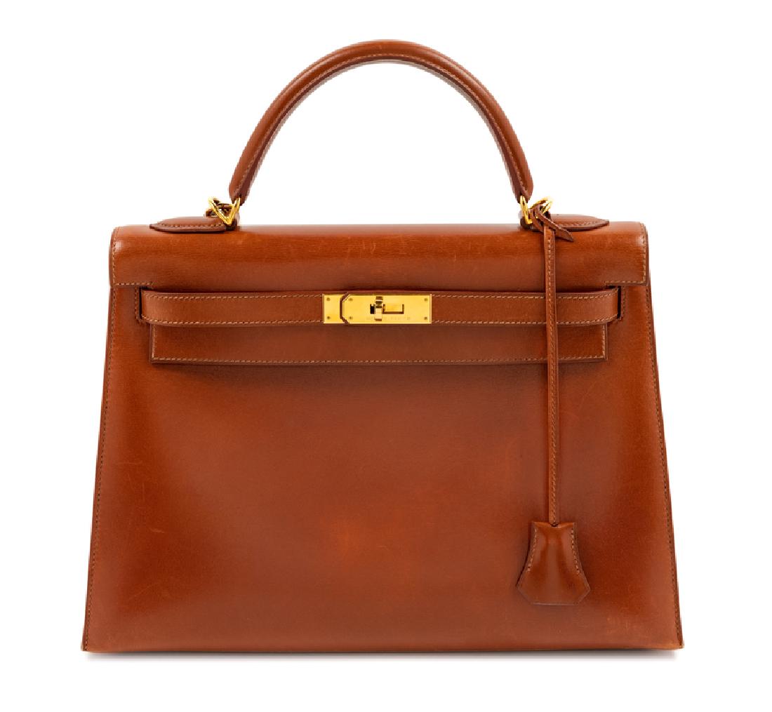 Hermes Brown Sellier 32cm Kelly Handbag, 2001: Hermes Brown Sellier 32cm Kelly Handbag, 2001 Gold plated hardware, a detachable shoulder strap, a clochette with lock and keys, a front flap turn lock closure, two interior slip pockets and one inter