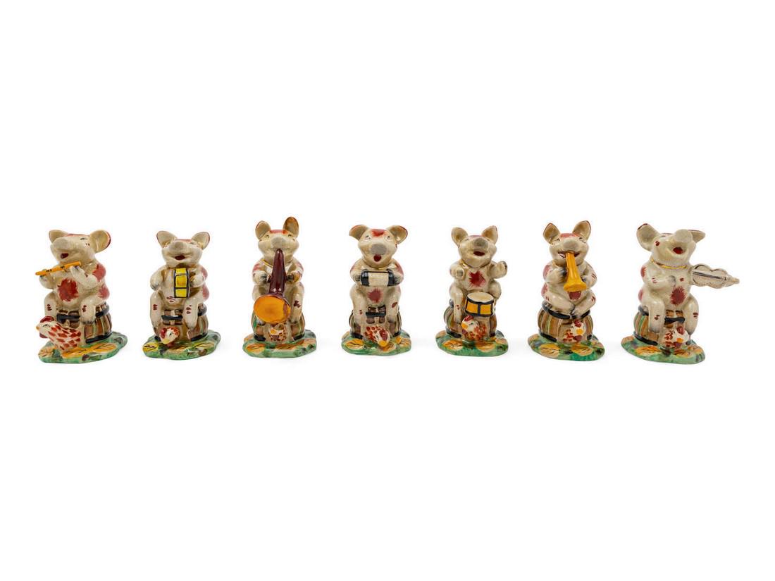 A Porcelain Pig Band comprising 7 musicians.<b: A Porcelain Pig Band comprising 7 musicians. Height of tallest 6 3/4 inches. Origin: Property from the Collection of James Flynn and Bill Wiley, Chicago, Illinois