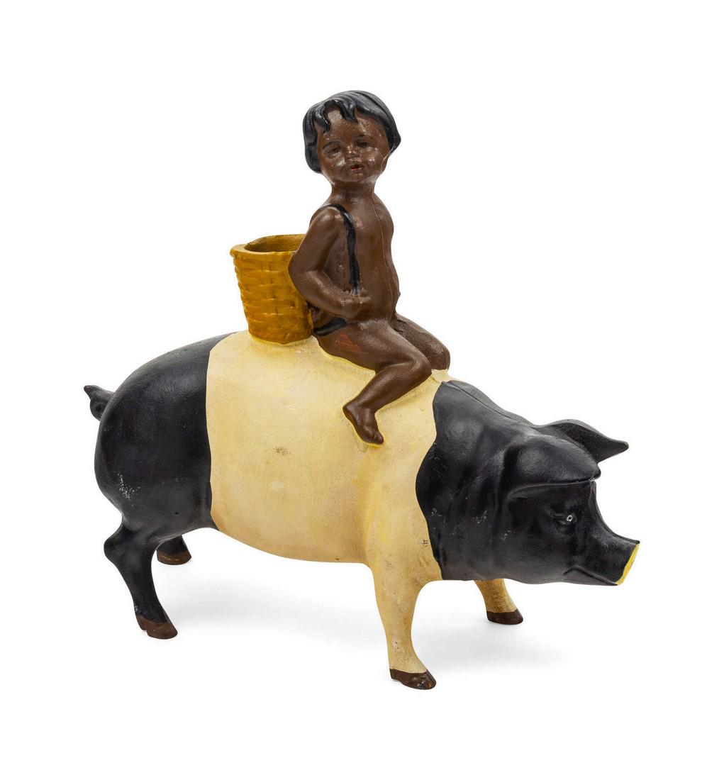 A Painted Metal Figural Group of a boy riding (1 of 1)