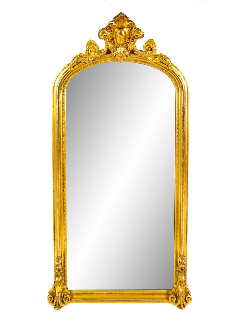 An American Gilt Gesso and Carved Wood Pier Mirro: An American Gilt Gesso and Carved Wood Pier Mirror Circa 1860 the domed crest centered with an oval cartouche among rocaille and foliate scrolls. Height 69 1/4 x width 34 1/2 inches.
