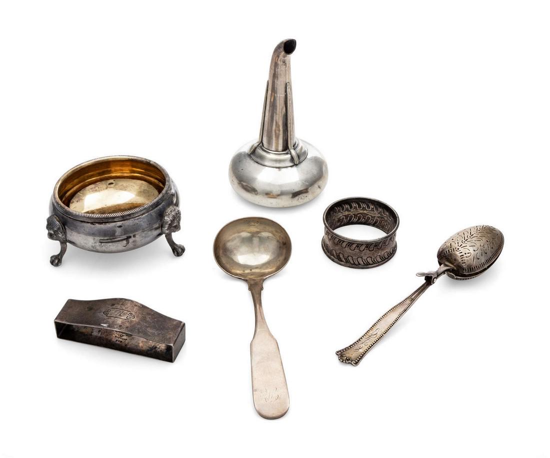 A Collection of Silver and Silver-Plate Table Art: A Collection of Silver and Silver-Plate Table Articles Various Makers, 20th Century comprising two silver napkin rings, a cream ladle and a tea straining spoon, together with a silver-plate salt cella