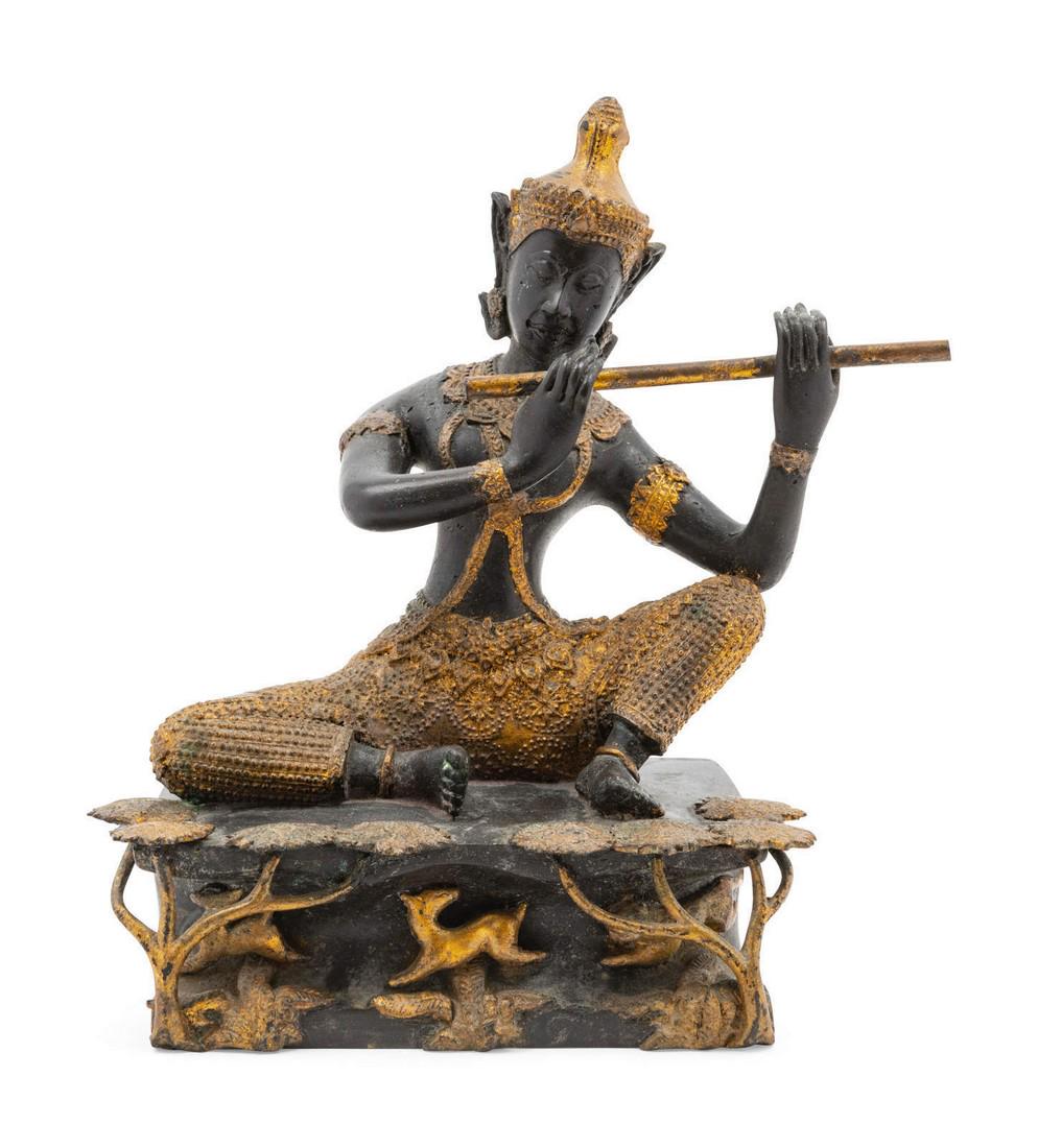 A Thai Gilt and Patinated Bronze Flute Player (1 of 2)