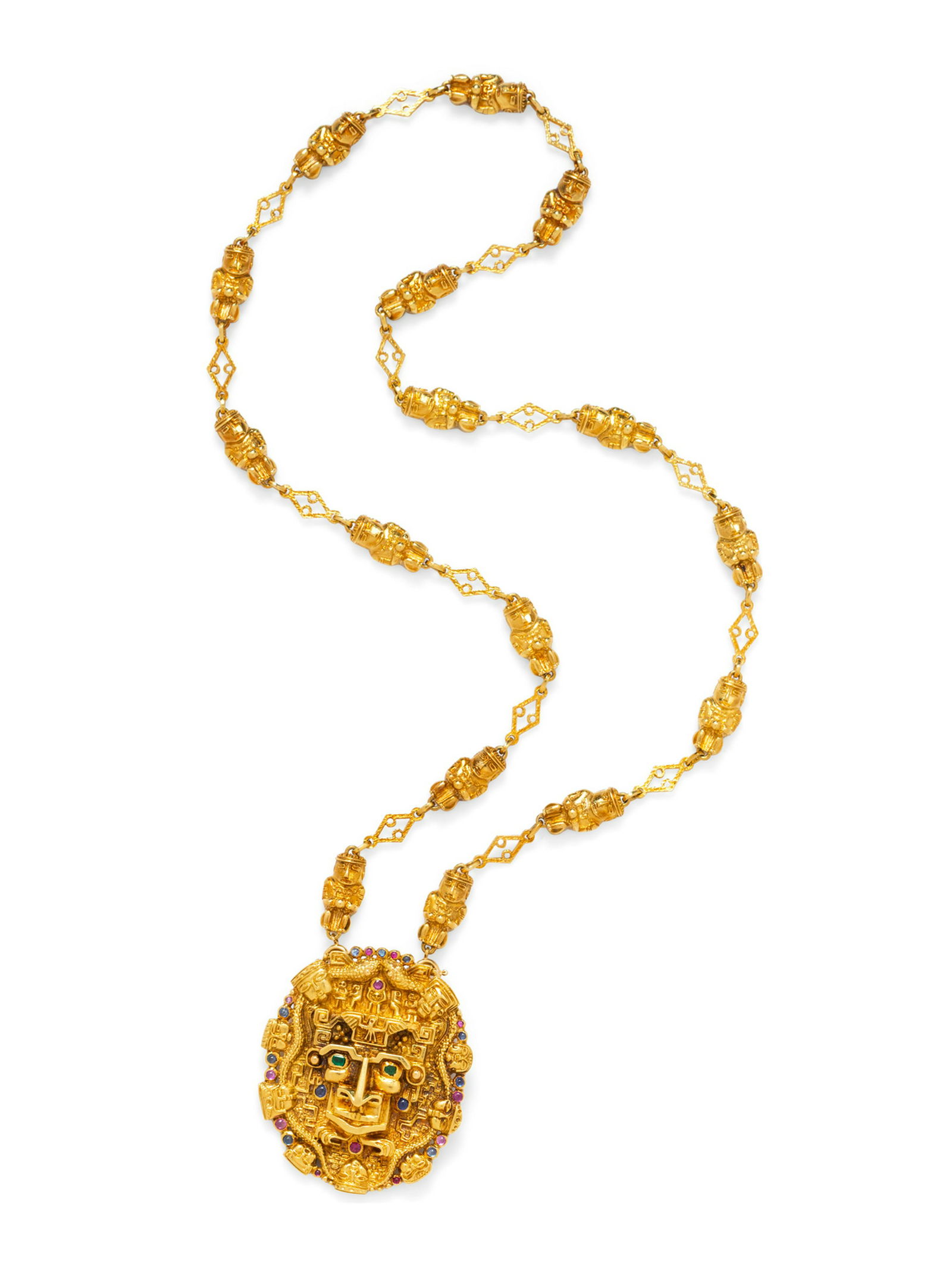 An 18 Karat Yellow Gold and Multigem Mesoamerican Motif (1 of 2)