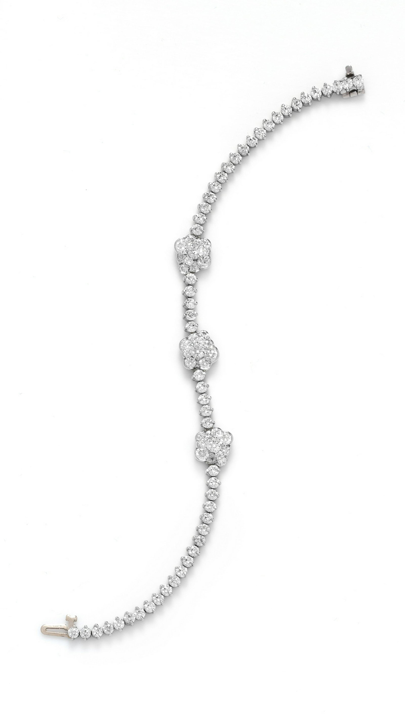 A Platinum and Diamond Bracelet,: A Platinum and Diamond Bracelet, containing numerous round brilliant cut diamonds weighing approximately 6.50 carats total. Stamp: Pt950. 14.00 dwts.