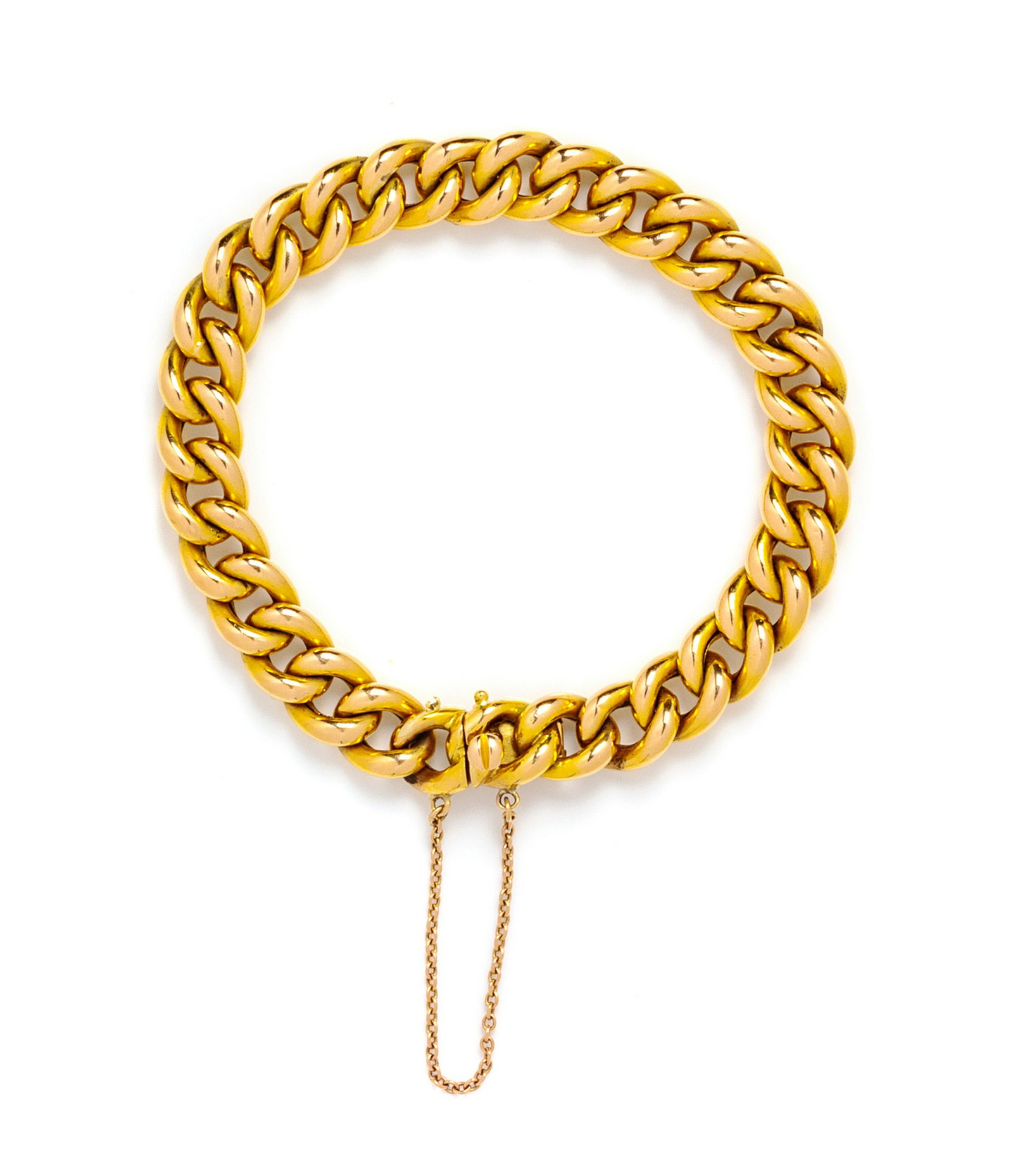 An 18 Karat Yellow Gold Bracelet, French,: An 18 Karat Yellow Gold Bracelet, French, consisting of a curb link chain measuring approximately 9.00 mm wide, with safety chain. Stamp: (French hallmarks). 10.50 dwts.