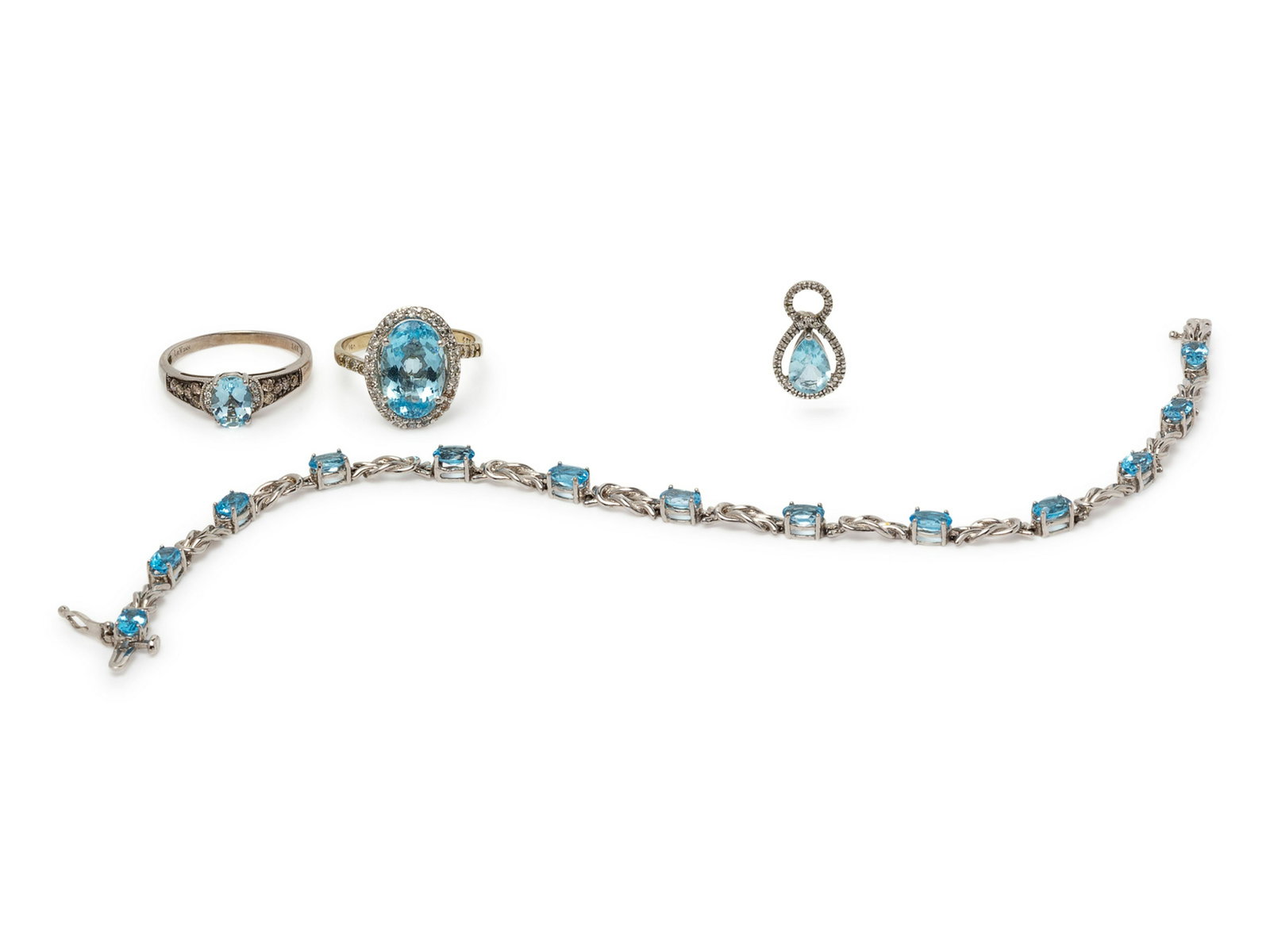 A Collection of White Gold and Aquamarine and Topaz: A Collection of White Gold and Aquamarine and Topaz Jewelry, consisting of a ring by Levian containing one oval shape aquamarine and 18 round brilliant cut diamonds and colored diamonds (origin of col