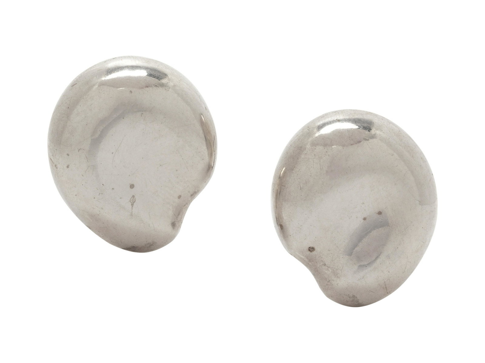 A Pair of Sterling Silver Earclips, Elsa Peretti for: A Pair of Sterling Silver Earclips, Elsa Peretti for Tiffany & Co., in an organic sculptural form. Stamp: TIFFANY + CO. PERETTI STERLING. 9.45 dwts.
