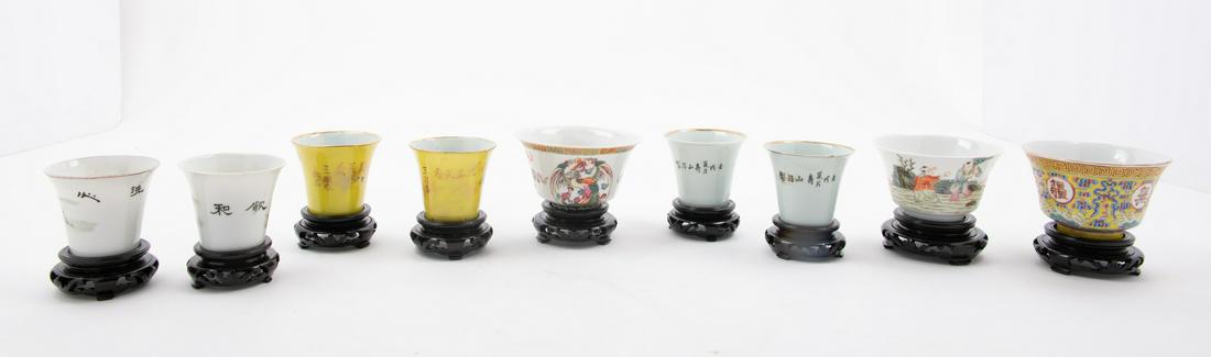 Nine Famille Rose Porcelain Tea Cups Largest: diam 2: Nine Famille Rose Porcelain Tea Cups LATE 19TH CENTURY-EARLY 20TH CENTURY the first a yellow ground example, decorated with four characters, wan shou wu jiang (boundless longevity), alternating ribbon