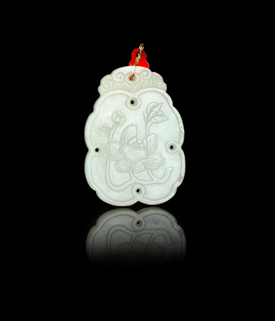 A Pale Celadon Jade Pendant Length 2 1/4 in., 6 cm. (1 of 2)