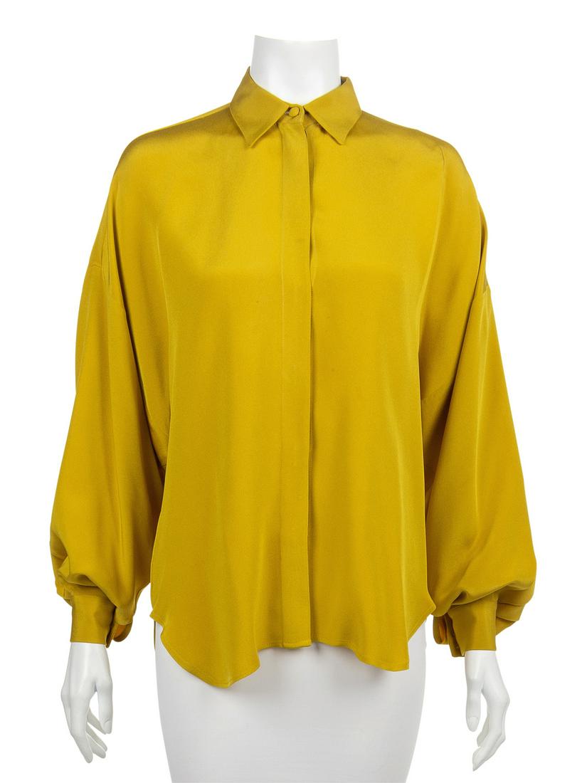 One Norman Kamali Blouse and One Romeo Gigli Blouse,: One Norman Kamali Blouse and One Romeo Gigli Blouse, 1980s-1990s The first: a Norma Kamali mustard yellow crepe blouse with spread collar, eased dropped shoulder with bat-wing sleeves ending in three-