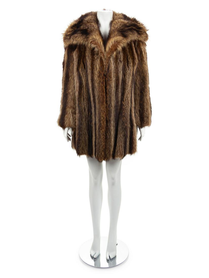 Raccoon Coat, 1970-80s: Raccoon Coat, 1970-80s Brown and tan raccoon coat with wide collar, pockets over the hips, long flared sleeves and a center front hook and eye closure. Label: Manor-Feldman / Chicago Approximate F