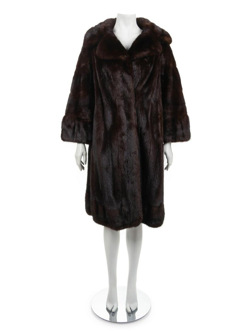 Bruno and Joseph Mink Coat, 1990-2000s: Bruno and Joseph Mink Coat, 1990-2000s Long dark brown mink coat with wide notched collar, long flared sleeves with horizontal bands of fur, center front hook and eye closure and hip pockets. Fully li
