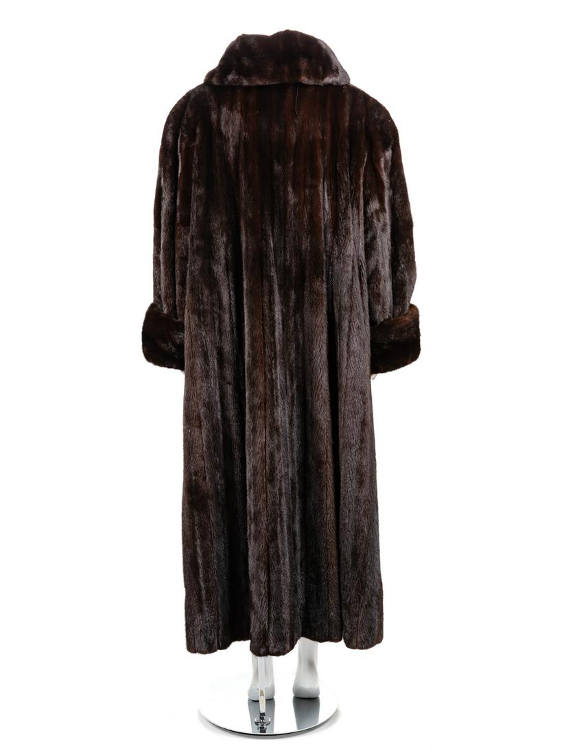 A Mink Full Length Coat: Dark brown mink fur full length coat with high shawl collar lapel, straight sleeves with rolled up cuffs, and hook and eye front closures. Label: Andriana Furs Approximate Flat Measurements Across the