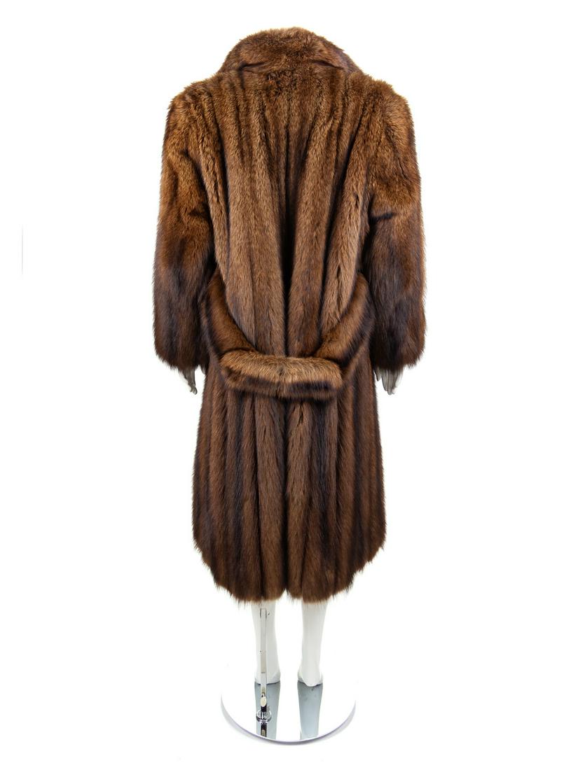 Chloe Sable Fur Coat, 1980s: Chloe Sable Fur Coat, 1980s Dark brown sable fur coat with shawl collar, straight sleeves, front pockets, and button and loop front closure. There is an attached belt at center back waist with hooks a