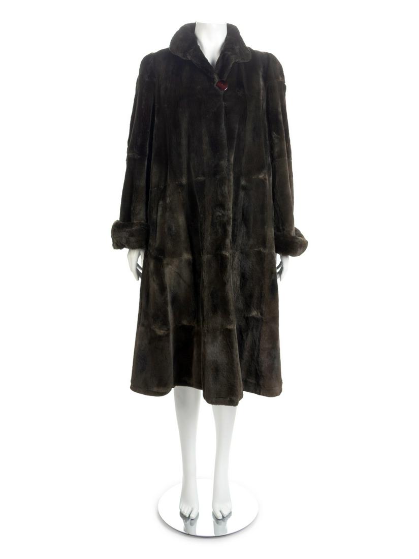 I. Magnin Long Fur Coat, 1980-90s: I. Magnin Long Fur Coat, 1980-90s Dark green chinchilla long and full at the hem fur coat with center front button and clasp closure. Hips pockets are lined with velveteen. Label: The Carol and Irwi