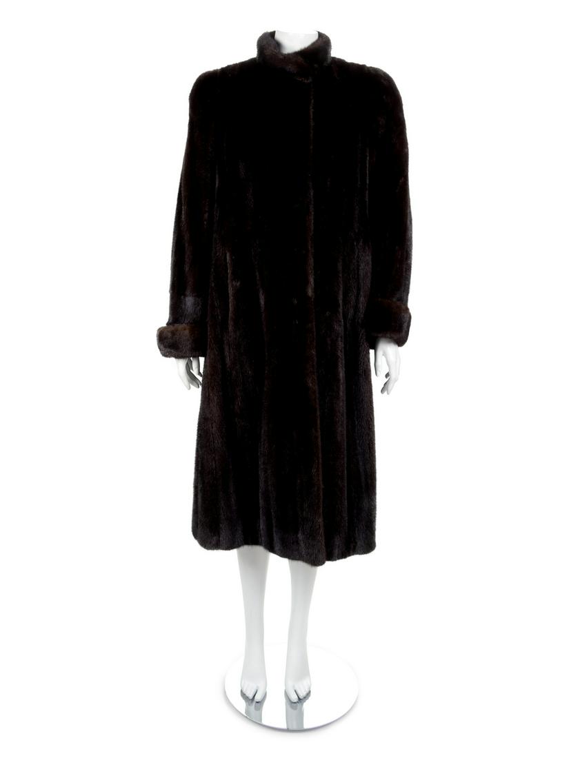 A Mahogany Full Length Mink Coat with Rolled Cuffs,: A Mahogany Full Length Mink Coat with Rolled Cuffs, 1980's Mahogany full length mink coat with stand collar, straight sleeves with rolled cuffs, front pockets, and hook and eye clousures at center fro