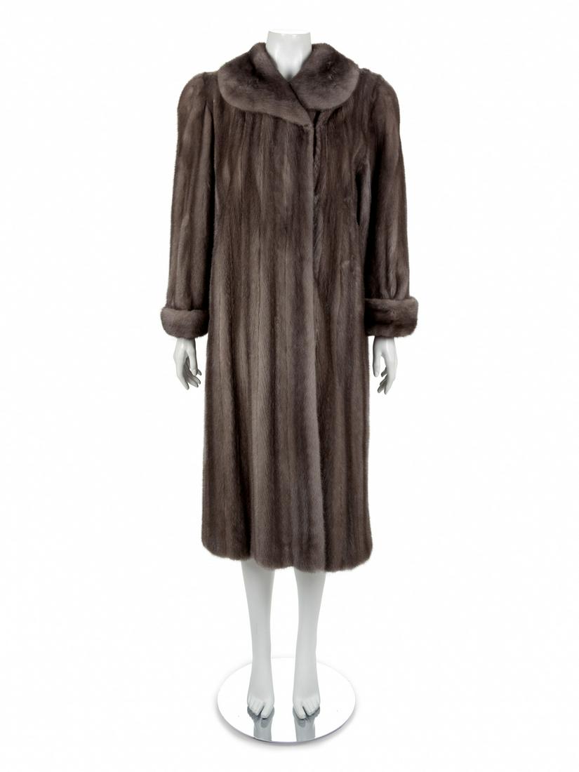 I. Ringler Long Mink Coat, 1990-2000s: I. Ringler Long Mink Coat, 1990-2000s Dark grey mink coat with fold down collar, long cuffed sleeves, hips pockets and a center front hook and eye closure. Full lined. Label: I. Ringler Approximat