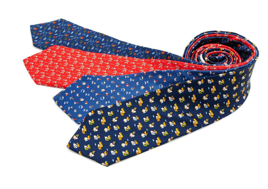 Four Salvatore Ferragamo Silk Ties,: Four Salvatore Ferragamo Silk Ties, the first; navy with pelican motif; the second; red with palm tree and pineapple motif; the third; blue with paper boat motif, the fourth; blue with sailboat and li