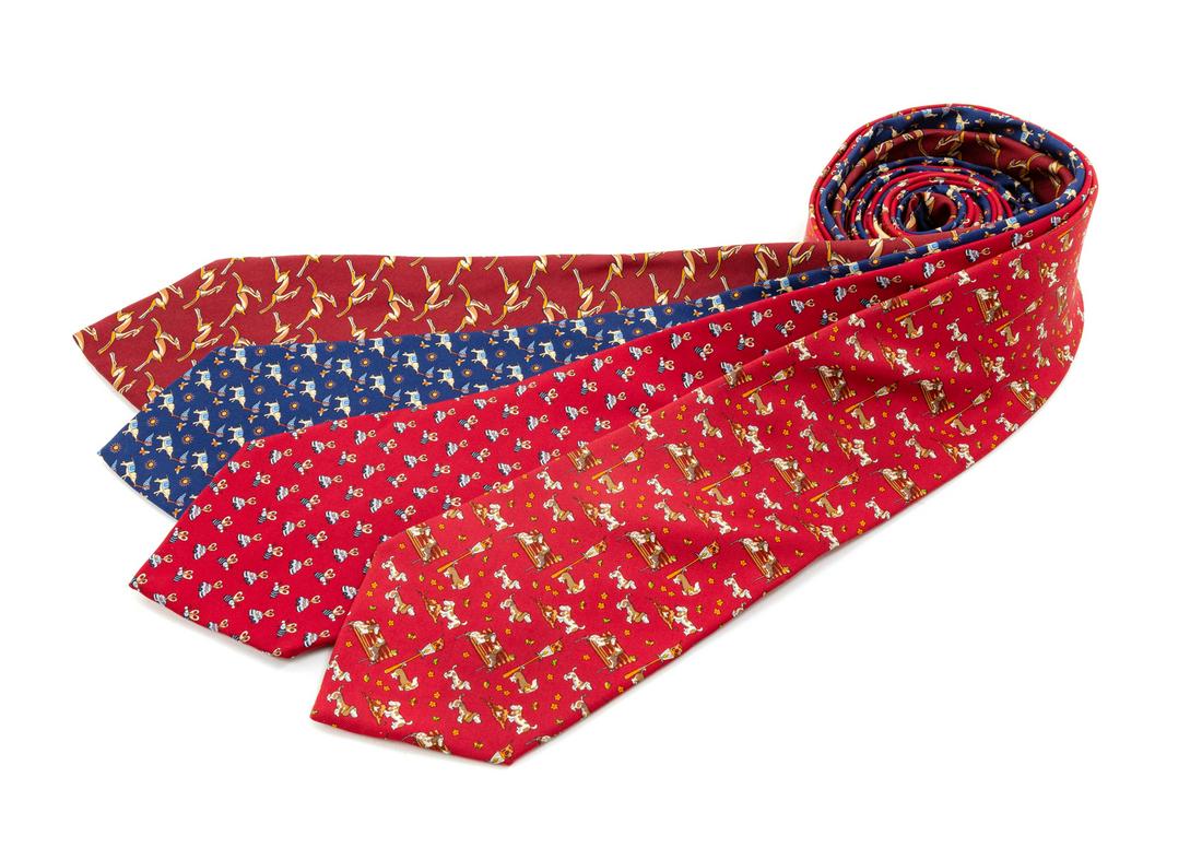 Four Salvatore Ferragamo Silk Ties,: Four Salvatore Ferragamo Silk Ties, the first; burgundy with gazelle motif, the second; red with beetle and car motif, the third; blue with elephant catching butterfly motif, the fourth; red with dog