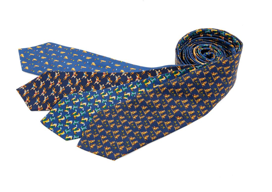 Four Salvatore Ferragamo Silk Ties,: Four Salvatore Ferragamo Silk Ties, the first; blue with owl motif, the second; blue with horse motif, the third; blue with cat motif, the fourth; navy with terrier dog motif. Each Labeled: Salvatore