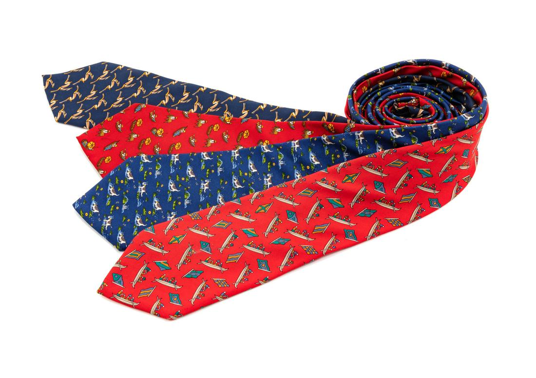 Four Salvatore Ferragamo Silk Ties,: Four Salvatore Ferragamo Silk Ties, the first; blue with dog motif, the second; red with rowing motif, the third; red with boat motif, the fourth; navy with gazelle motif. Each Labeled: Salvatore Ferr