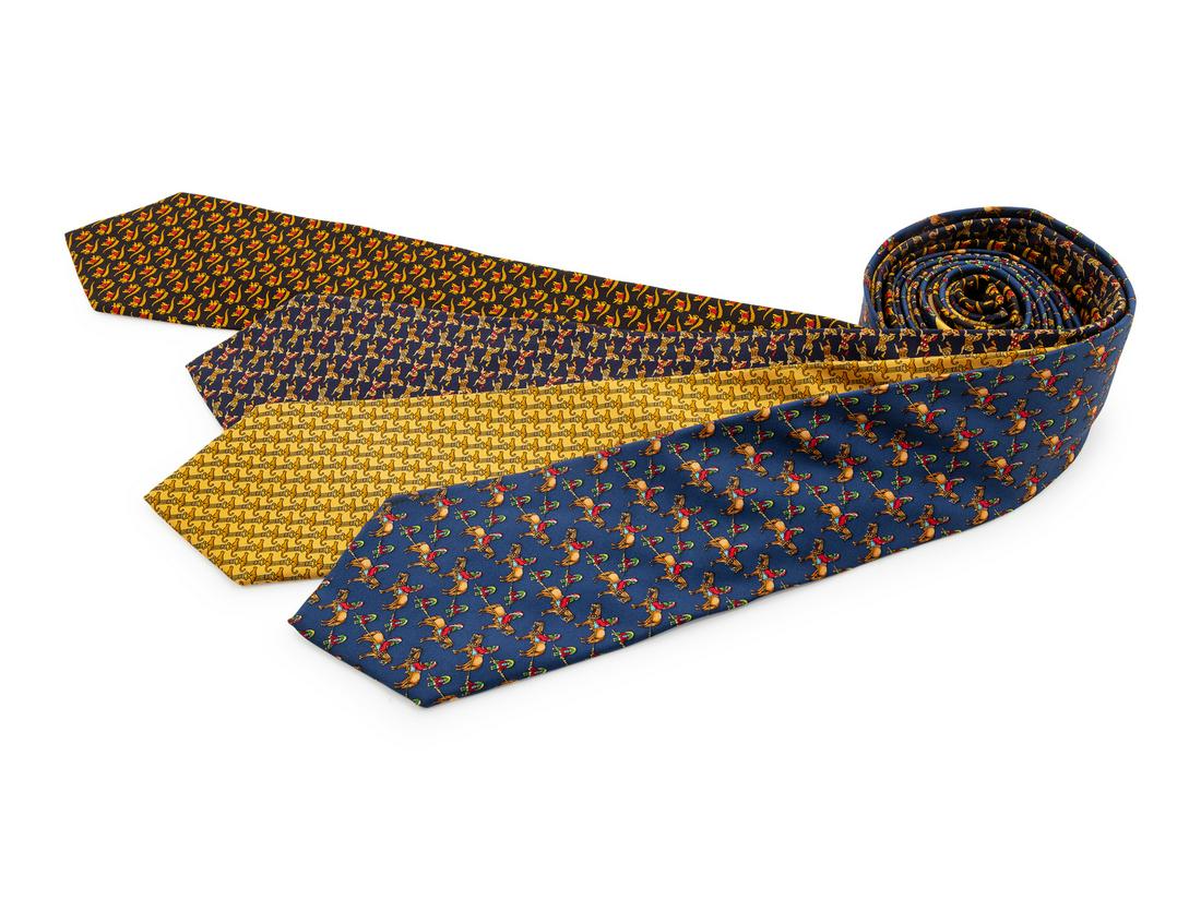 Four Salvatore Ferragamo Silk Ties,: Four Salvatore Ferragamo Silk Ties, the first; black with elephant and flag motif, the second; blue with horse and Native American motif, the third; yellow with leopard and column motif, the fourth; n